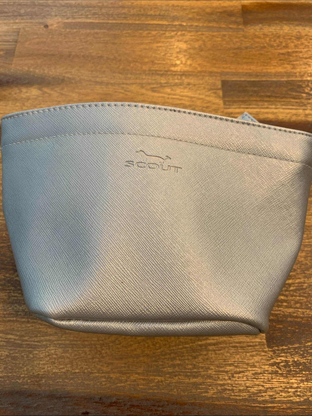 Scout zippered bag with pink quilted interior.